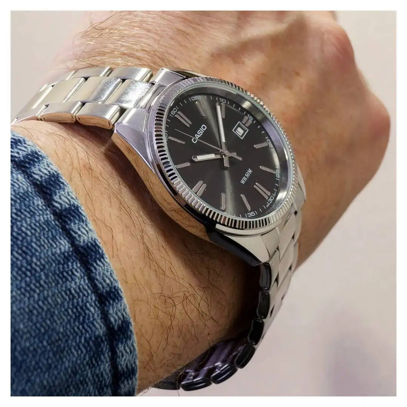 Casio MTP-1302D-1A1 Classic Men's Watch with Black Dial, Neon Display, and Stainless Steel Strap; features mineral glass, date indicator, and 5 bar water resistance, perfect for stylish everyday wear.